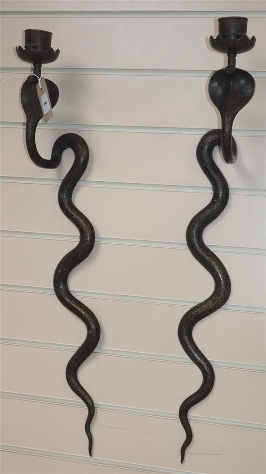 A pair of Indian snake sconces length 75cm